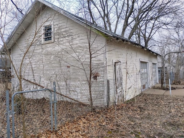 view of side of home featuring a garage