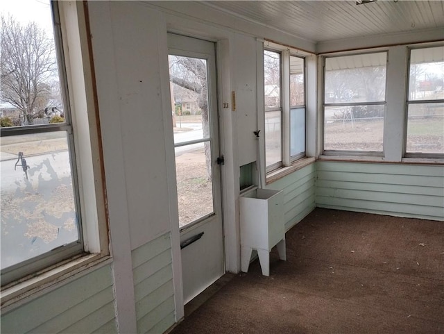 unfurnished sunroom with plenty of natural light