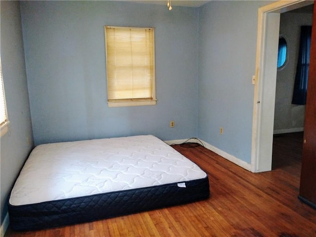 bedroom featuring hardwood / wood-style flooring