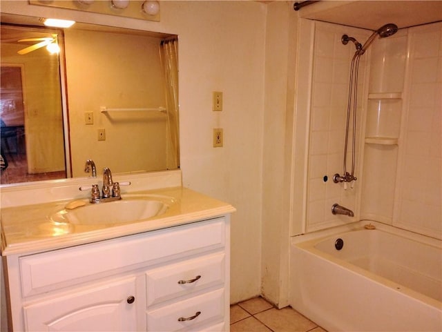 bathroom featuring tile patterned flooring, vanity, and  shower combination