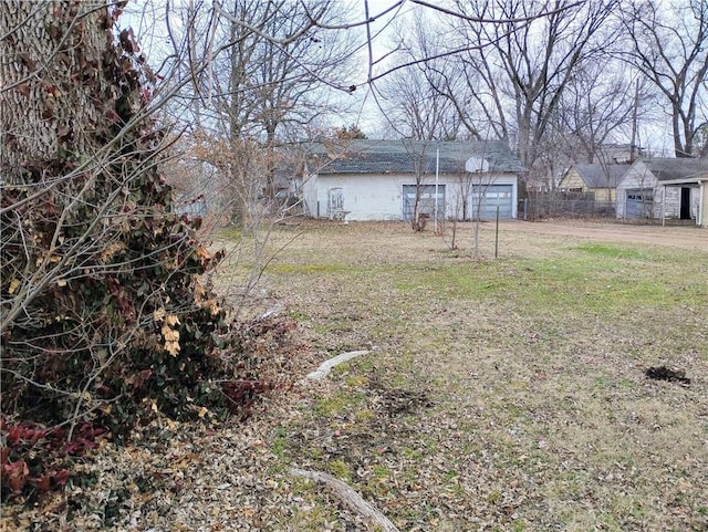 view of yard featuring a garage