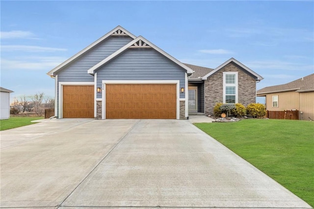 view of front of property with a garage and a front lawn