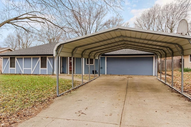 view of front of house featuring a garage, a front lawn, and a carport