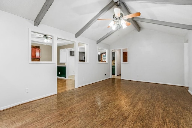 unfurnished living room with lofted ceiling with beams, dark hardwood / wood-style floors, and ceiling fan