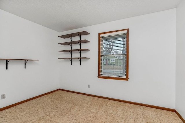 spare room featuring a textured ceiling