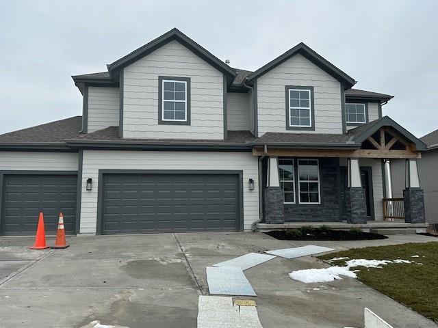 view of front of house with a garage and covered porch