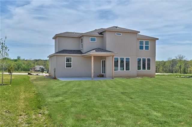 back of house featuring a yard and a patio area