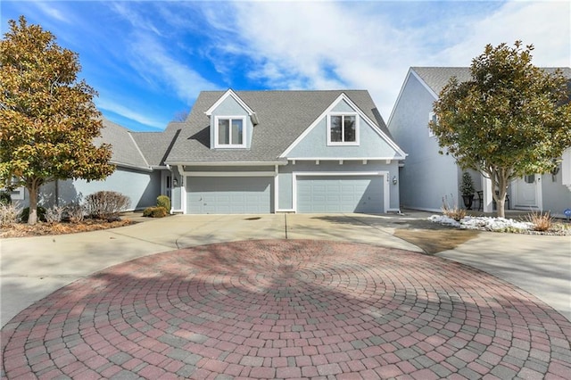 view of front facade with a garage, curved driveway, and stucco siding