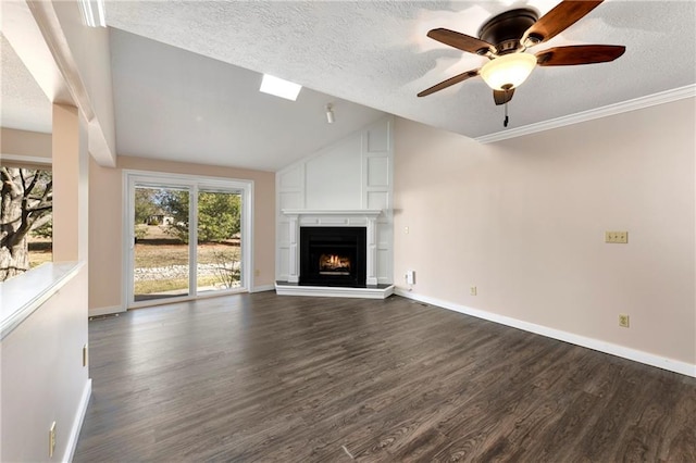 unfurnished living room featuring dark wood finished floors, a fireplace, lofted ceiling, a textured ceiling, and baseboards