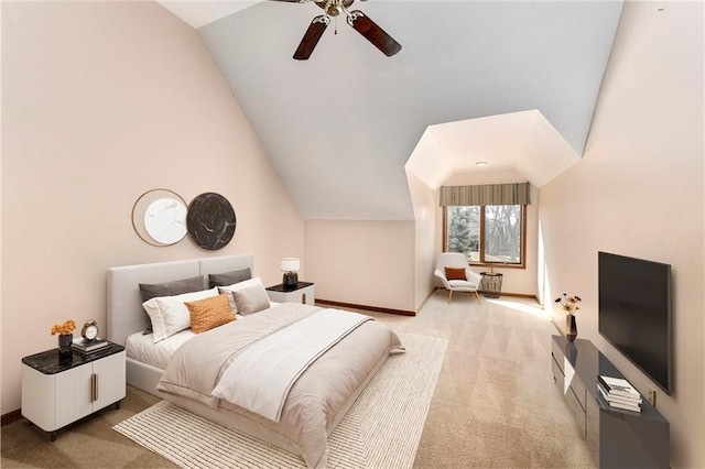 carpeted bedroom featuring vaulted ceiling, ceiling fan, and baseboards