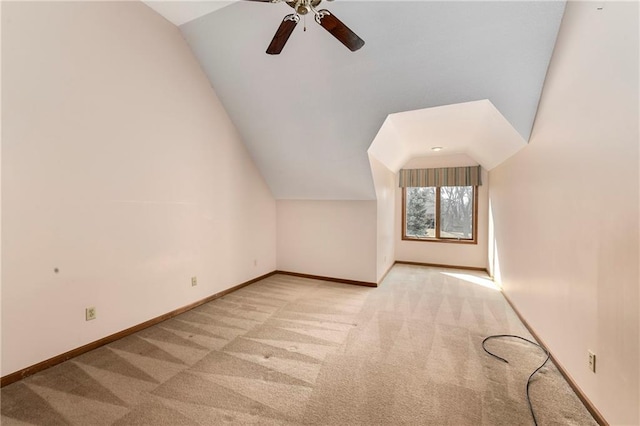 bonus room featuring lofted ceiling and baseboards