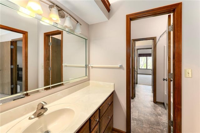 bathroom with baseboards and vanity