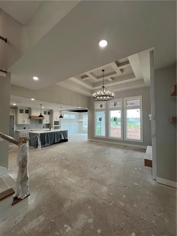 2209 W 176th Pl, Overland Park, KS 66085 - living area with a chandelier, a raised ceiling, and recessed lighting