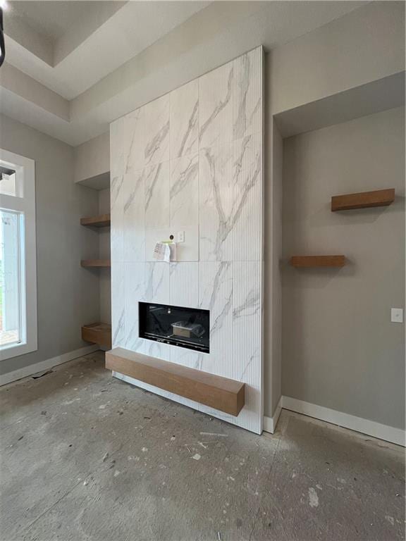2209 W 176th Pl, Overland Park, KS 66085 - unfurnished living room featuring a premium fireplace, baseboards, and built in shelves