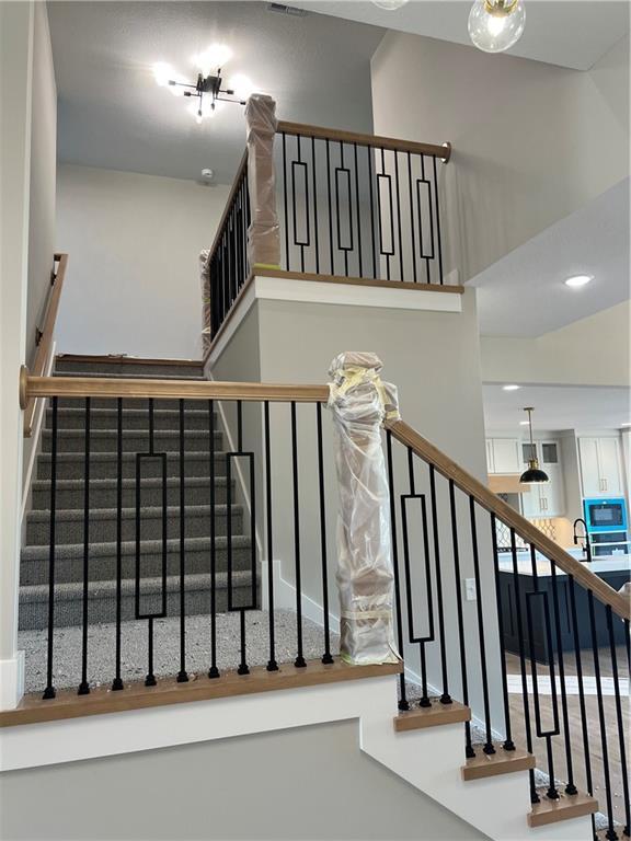 2209 W 176th Pl, Overland Park, KS 66085 - stairs with a high ceiling