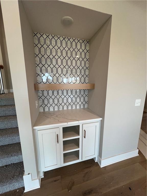 2209 W 176th Pl, Overland Park, KS 66085 - detailed view of wood finished floors and baseboards
