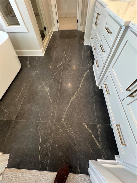 2209 W 176th Pl, Overland Park, KS 66085 - bathroom with toilet and granite floors