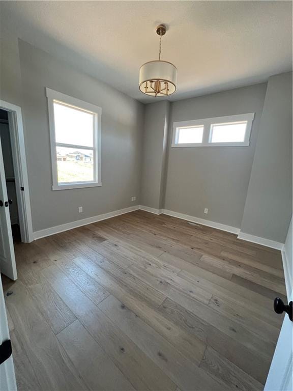 2209 W 176th Pl, Overland Park, KS 66085 - unfurnished room with hardwood / wood-style flooring and baseboards