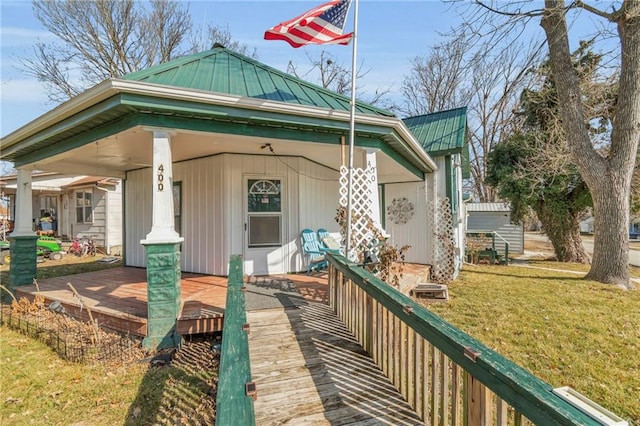 exterior space featuring a yard and a porch