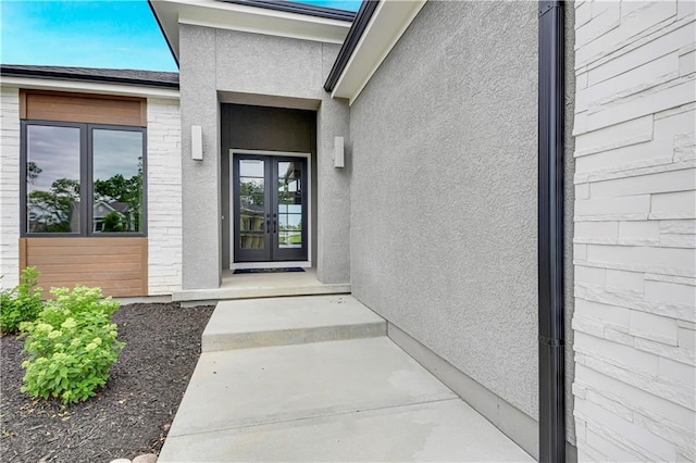 24909 W 98th Pl, Lenexa, KS 66227 - entrance to property featuring french doors and stucco siding