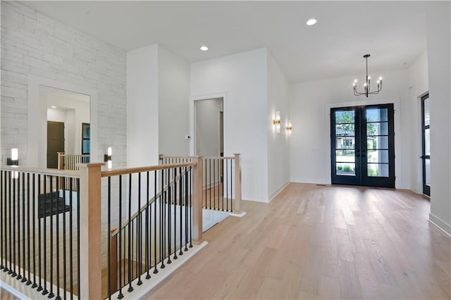 24909 W 98th Pl, Lenexa, KS 66227 - entryway featuring a chandelier, wood finished floors, french doors, and recessed lighting