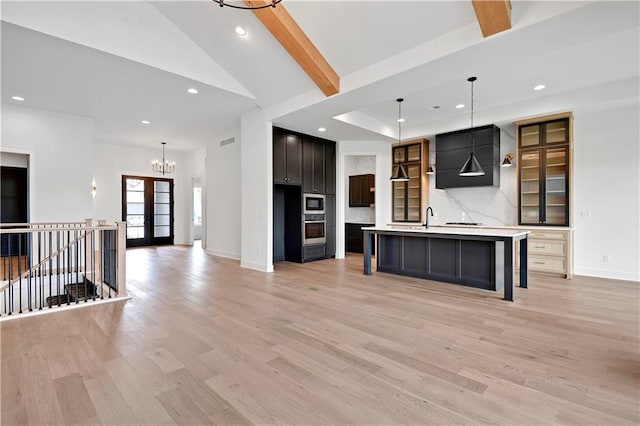 24909 W 98th Pl, Lenexa, KS 66227 - unfurnished living room featuring a chandelier, recessed lighting, light wood-style flooring, and vaulted ceiling
