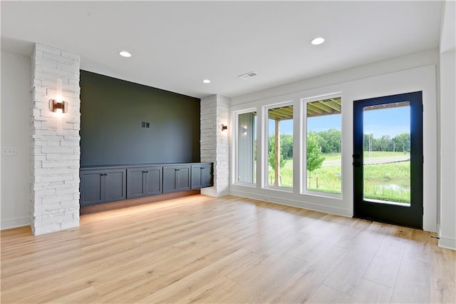 24909 W 98th Pl, Lenexa, KS 66227 - unfurnished living room featuring light wood finished floors and recessed lighting