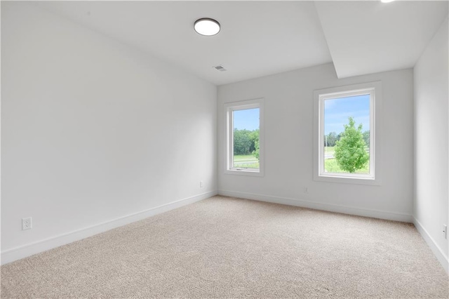 24909 W 98th Pl, Lenexa, KS 66227 - spare room featuring baseboards and light carpet