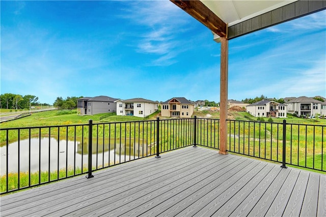 24909 W 98th Pl, Lenexa, KS 66227 - deck featuring a residential view, a yard, and a water view