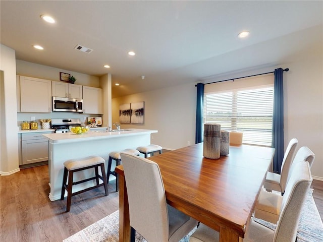 dining room featuring light hardwood / wood-style floors