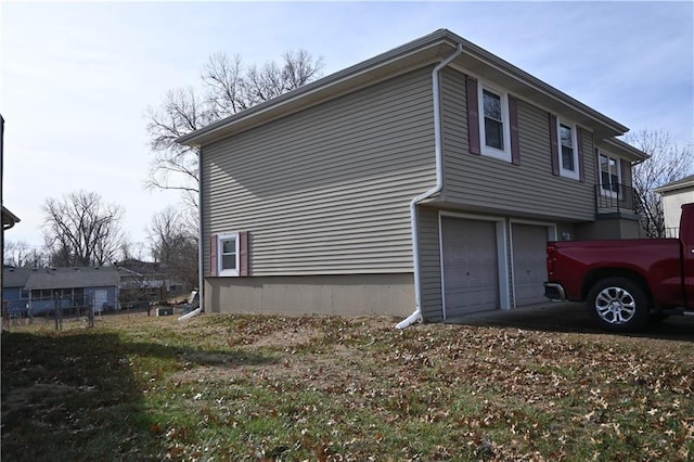 view of side of property with a garage