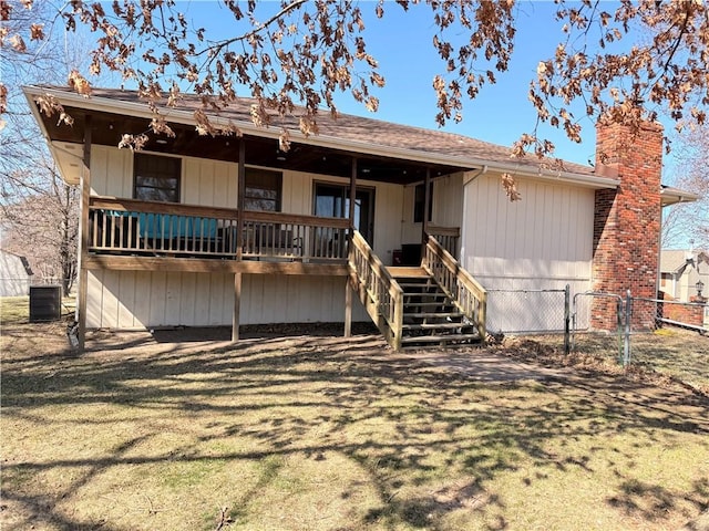 view of front of property with a gate, fence, cooling unit, stairway, and a chimney