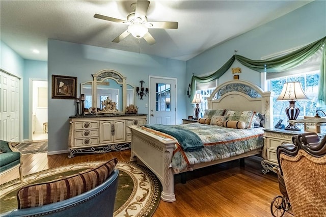 bedroom with hardwood / wood-style flooring and ceiling fan