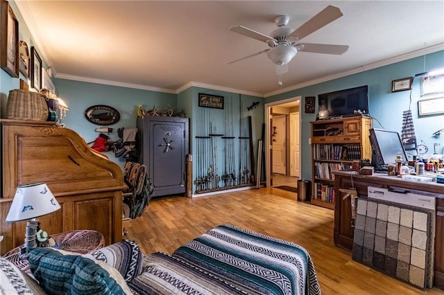 interior space featuring ceiling fan, ornamental molding, and light hardwood / wood-style floors