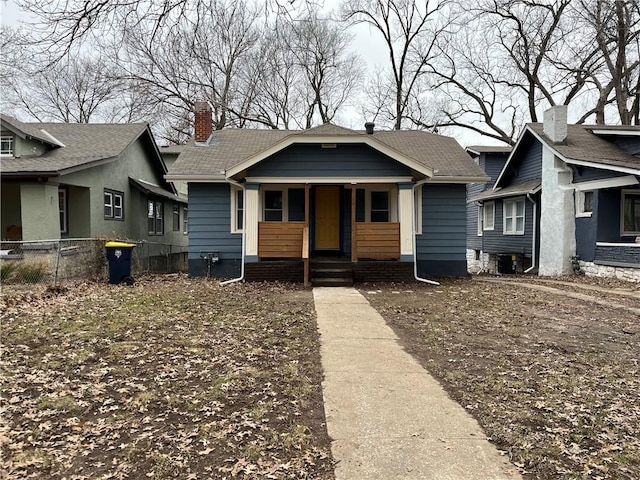 bungalow with covered porch and central air condition unit