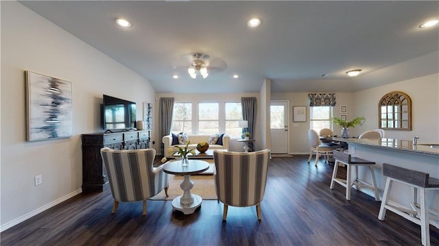 living room featuring ceiling fan, plenty of natural light, dark hardwood / wood-style floors, and lofted ceiling