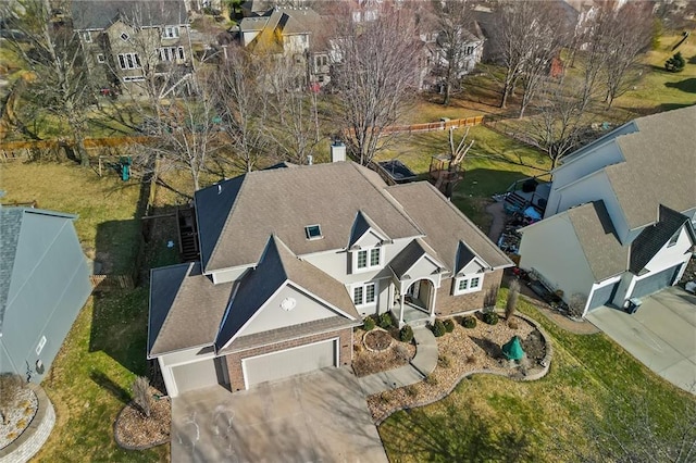 birds eye view of property with a residential view