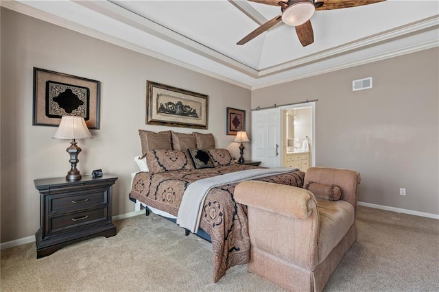 bedroom with light colored carpet, visible vents, ensuite bathroom, ornamental molding, and baseboards