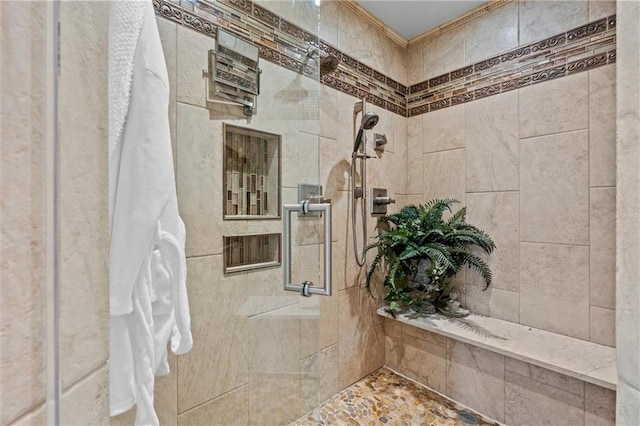 full bath with a tile shower