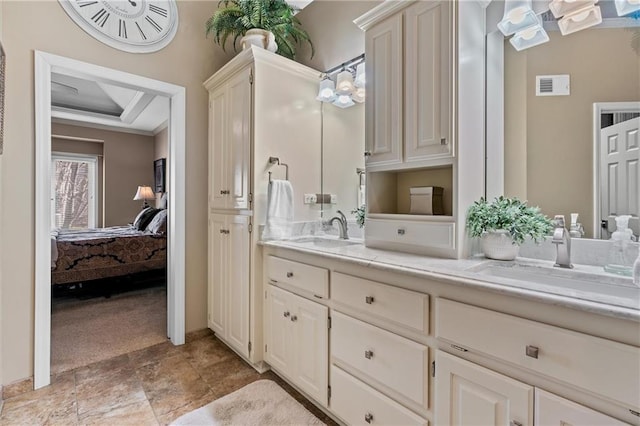 bathroom featuring double vanity, ensuite bath, visible vents, and a sink