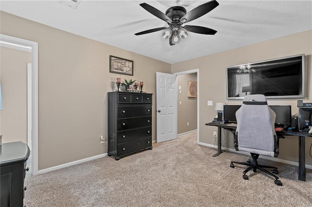 office space with light carpet and baseboards