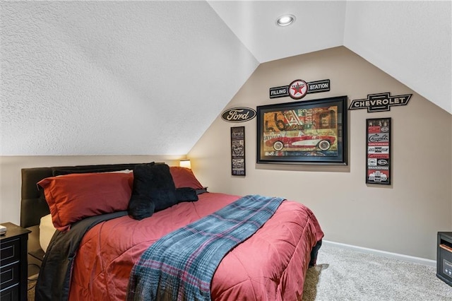 carpeted bedroom featuring lofted ceiling, a textured ceiling, and baseboards