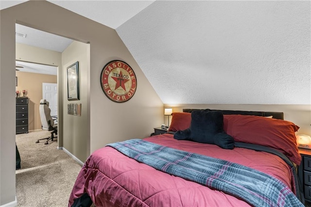 bedroom featuring vaulted ceiling, carpet, visible vents, and baseboards