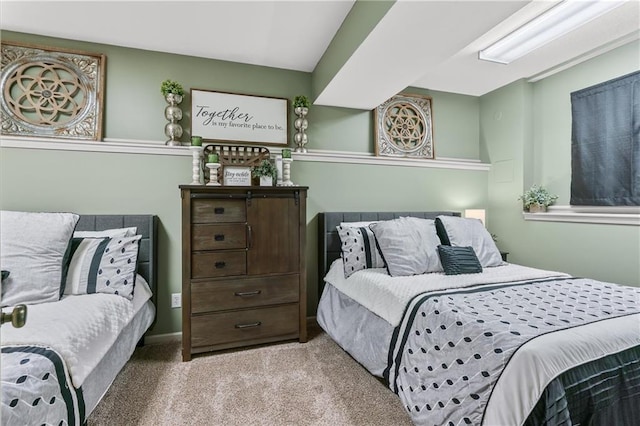 bedroom featuring light colored carpet