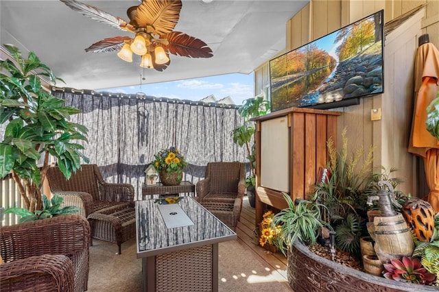 balcony featuring ceiling fan and an outdoor hangout area