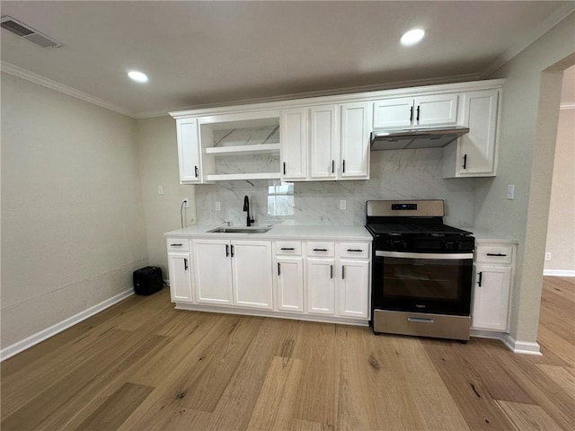 kitchen featuring white cabinetry, sink, stainless steel gas range, and light wood-type flooring