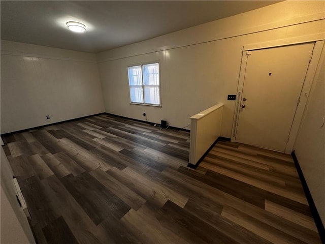 foyer entrance with dark wood-type flooring