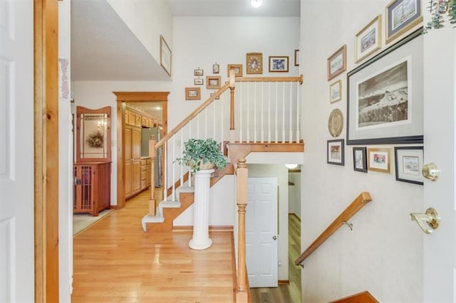 stairway featuring hardwood / wood-style floors