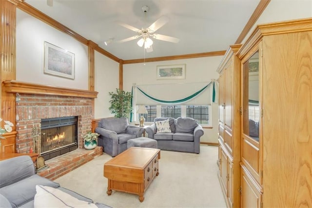 living room featuring crown molding, a fireplace, light colored carpet, and ceiling fan