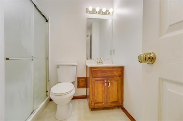 bathroom featuring vanity, toilet, and walk in shower